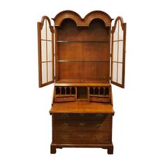 an old fashioned wooden desk with glass doors on it's top and bottom shelf