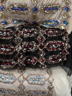 several different types of beaded and sequins are stacked on top of each other