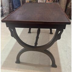 a wooden table sitting on top of a carpeted floor