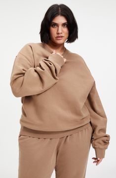 Extra-long sleeves and a drapey oversized fit elevates the lofty vibe of a cotton pullover that's lined with soft and snuggly fleece. 26" length (size 2) Crewneck Long sleeves Ribbed cuffs and hem 100% cotton Machine wash, tumble dry Imported Women's Clothing Black Owned and Founded Beige Sweatshirt With Ribbed Cuffs For Loungewear, Beige Ribbed Cuffs Sweatshirt For Loungewear, Relaxed Fit Drop Shoulder Sweater For Fall, Relaxed Fit Sweater With Drop Shoulder For Fall, Relaxed Fit Fall Sweater With Drop Shoulder, Comfortable Beige Long Sleeve Sweatshirt, Cozy Sweats With Soft Texture For Fall, Beige Long Sleeve Sweatshirt With Ribbed Cuffs, Cozy Sweatshirt With Soft Texture And Relaxed Fit