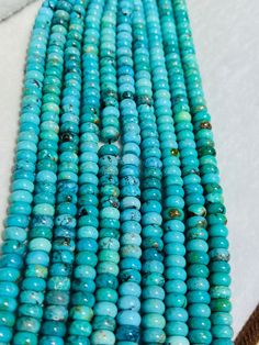 a close up of some kind of blue bead