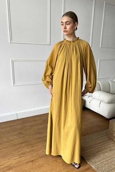 Elevate your autumn wardrobe with our Gathered Neckline Long Sleeve Maxi Dress in a stunning mustard hue. Crafted from 100% cotton, this dress ensures both comfort and breathability. The elegantly gathered neckline and long sleeves make it perfect for layering during the cooler months. Flowing gracefully with every step, this versatile maxi dress can be styled with boots for a casual look or dressed up with accessories for a night out. A must-have piece that combines timeless elegance with effor Gathered Neckline, Mustard Dressing, Autumn Wardrobe, Sleeve Maxi Dress, Long Sleeve Maxi, Style Expert, Tie Neck, Fall Wardrobe, Long Sleeve Maxi Dress