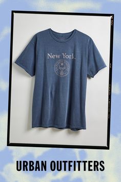 New York Crest graphic tee. Academia-inspired tee features a distressed-finish graphic at the front of the cotton jersey design. In a standard fit with a ribbed crew neck and short sleeves. Features New York crest graphic tee Regular fit Ribbed crew neck Short sleeves Content + Care 100% Cotton Machine wash Imported Size + Fit Model is 6’2" and wearing size Large Measurements taken from size Large Chest: 23" Length: 30" | New York Crest Tee in Navy, Men's at Urban Outfitters Urban Outfitters Screen Print T-shirt For Streetwear, Urban Outfitters Relaxed Fit T-shirt For Streetwear, Collegiate Crew Neck T-shirt For Streetwear, Sporty Crew Neck Soft-washed T-shirt, Sporty Soft-washed Crew Neck T-shirt, Blue College Style T-shirt For Streetwear, College Tops With Graphic Print And Relaxed Fit, Graphic Print Relaxed Fit Tops For College, Relaxed Fit Graphic Print Top For College