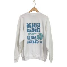 Brand New Without Tags Gildan Ocean Beach Graphic Pullover Crew Neck Sweatshirt Size Xl "Ocean Beach" Printed On The Back. The Front Is Plain Crew Neck Pullover Style Printed With Sublimation So The Design Will Stay On Forever! Doesn't Peel Or Crack White Long Sleeve Tops For Vacation, Oversized Sweatshirt For Summer Beach, Oversized Sweatshirt For Beach In Summer, Blue Graphic Print Sweatshirt For The Beach, Crew Neck Sweatshirt For Beach In Spring, Oversized White Vacation Tops, Oversized White Beachy Top, White Tops For Vacation Loungewear, Spring Beach Crew Neck Sweatshirt