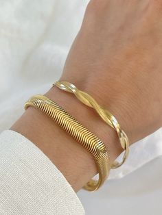 D E T A I L S - 18K Gold Filled Chain over Brass  - 3mm Width -Twisted Herringbone  - 8mm Width - Slinky Snake Chain  - Hypoallergenic  - Please note: Each bracelet is sold individually and is not part of a set. M A T E R I A L S At Dylan Rae, we are committed to handcrafting jewelry that is perfect for everyday wear. Our high-quality gold filled designs contain 100+ times more real gold than gold plated components. The thick outer layer of gold makes it highly durable and safe for people with a Flexible Gold Cuff Bracelet As Gift, Flexible Gold Bangle Bracelet As Gift, Flexible Gold-plated Bangle As Gift, Flexible Gold Bangle Bracelet For Gift, Flexible Yellow Gold Cuff Bracelet Gift, Flexible Bangle Bracelet As Gift, Gold Flexible Bangle Bracelet, Yellow Gold Braided Bangle Bracelet As Gift, Layering Bracelets