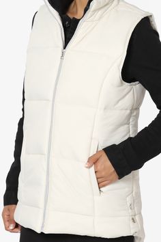 Padded vest is made from quilted matte nylon with warming fill. Perfect for the transitional months, it has zip pockets and side button details. Style this womens vest with a sports outfit, work attire, or everyday look. Perfect for throwing over long sleeve tops, sweaters, and lightweight coats.Funnel neck, Sleeveless, Front zipper closureSide zip pockets, Side button detailsHi low hem, Filled with insulating polyester, Padded designFits true to US size, S=Size(4-6), M=Size(8-10), L=Size(12-14) Nylon Workwear Vest, Sporty Winter Vest, Winter Nylon Vest With Zipper Closure, Nylon Vest With Zipper Closure For Winter, Nylon Work Vest For Fall, Casual Nylon Vest For Workwear, Fitted Quilted Nylon Vest, Nylon Vest With Zipper Closure For Fall, Fall Nylon Vest With Zipper Closure