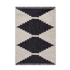 a black and white rug with fringes on the bottom, in two different colors