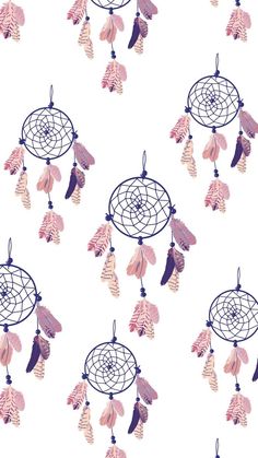 a white background with pink and brown dream catchers hanging from it's sides