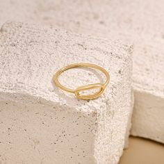 Our Open Oval Ring is a stunning embodiment of modern elegance. The open oval design symbolizes the intricate dance of interconnectedness and harmony in life. Its sleek and minimalist aesthetic embodies understated sophistication, promising to captivate attention with every gesture. - Made in 14k solid gold - Band Width: 1.15 mm / 0,045 inches - Top Width: 5.15 mm / 0.20 inches- Thickness: 1.35 mm / 0,053 inches -This product comes with iconic Norm Jewels gift box Solid Gold Band, Oval Ring, Oval Rings, Gold Piece, Minimalist Aesthetic, Gold Band, Stackable Rings, Modern Elegance, Signet Ring