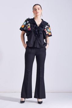 Black ruffled top with floral embroidered peplum sleeves. Paired with a bootcut pant. - Aza Fashions Peplum Sleeves, Black Ruffle Top, Ruffled Top, Black Luxury, Top And Pants Set, Bootcut Pants, Black Ruffle, Pant Set, Ruffle Top