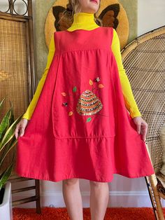 "Rare 1960s Fruit of the Loom cotton trapeze smock dress 🐝 Novelty bee painting with embellishments. So fun to layer and style too! Buttons down the back 100% cotton Shirt is not included Tag size Large, go by measurements below. CONDITION: excellent vintage condition, all but top button were added MEASUREMENTS (taken laying flat, already doubled:) 35\" long 42\" pit to pit 52\" waist 60\" hip 15\" shoulder 8-10\" arm opening Model is 5'2 34/27/38 for reference Follow us on Instagram for first Sack Dress, Bee Painting, Spring Fits, Tent Dress, Trapeze Dress, Smock Dress, Jumper Dress, Bee Hive, Fruit Of The Loom