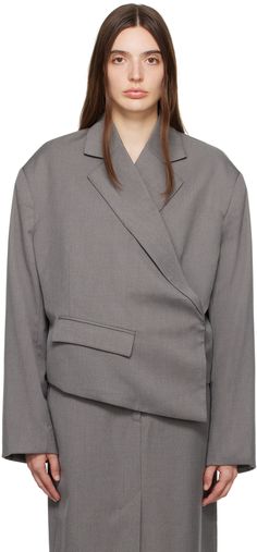 Recycled polyester-blend twill blazer. · Asymmetric wrap construction · Notched lapel · Concealed offset button closure · Flap pockets · Padded shoulders · Four-button surgeon's cuffs · Fully lined Supplier color: Dark gray Asymmetrical Single-breasted Outerwear For Work, Asymmetrical Spring Business Blazer, Modern Asymmetrical Outerwear For Work, Asymmetrical Blazer For Business In Spring, Spring Asymmetrical Business Blazer, Tailored Asymmetrical Outerwear For Work, Asymmetrical Spring Office Blazer, Spring Office Asymmetrical Blazer, Birger Christensen