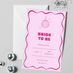 a pink card with the words bride to be written on it and some buttons next to it