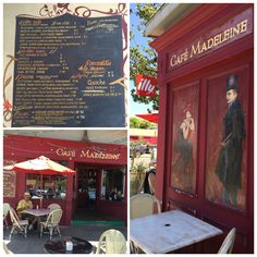 the outside of a cafe with tables and chairs