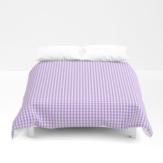 a purple and white checkered comforter with two pillows