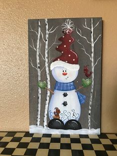 a painting of a snowman in the woods