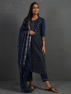 A gold hand block printed chanderi kurta in indigo with gota details in placket and cuff. The piece comes with a matching slip in mul and pants with elasticated - draw string adjustable waist band Kurta measurements (in Inches): Size S: Bust - 39", Waist - 38" Size M: Bust - 42", Waist - 41" Size L: Bust - 45", Waist - 44" Length: 47", Sleeve length: 17" Pant Measurements (in Inches): Size S: Waist - 30-32" Size M: Waist - 33-35" Size L: Waist - 36-38" Length: 35" Fabric: Chanderi (Cotton silk)