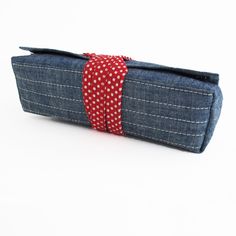 "Sew a pen pouch or small tool, make-up, or notions case with a flat box bottom base and a tie closure with this PDF SEWING PATTERN. This pouch has beautiful clean lines and pretty close to perfectly square flap corners thanks to the way it is put together. The underside of this pouch has a separate fabric piece that gives it a uniformly flat bottom to help it sit upright. Page 1 of the pattern document includes info about how to add this base to other projects. Two VELCRO tabs hold the flap dow Rectangular Pouch With Pen Holders, Rectangular Pencil Case With Pen Holders, Rectangular Everyday Pouch With Pen Holders, Rectangular Zipper Pouch Pencil Case As Gift, Rectangular Pencil Case With Pen Slots For Crafting, Rectangular Pencil Case With Zipper As Gift, Rectangular Zipper Pencil Case As Gift, Rectangular Red Pencil Case With Pen Holders, Red Rectangular Pencil Case With Pen Holders