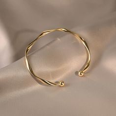 ✦ Our Simple Gold Wave Open Cuff Bangle Bracelet is a dainty and stylish accessory perfect for everyday wear. Crafted from high-quality materials and plated with a shiny gold finish, this bracelet features a unique wave design and an open cuff for comfortable wear. It makes a thoughtful gift for her, best friend or as a couple bracelet. ----------- DETAILS ------------ Diameter: 6.2cm- Size: Adjustable - Color: Gold/ Silver- Materials: Alloy, Gold Plating- SKU: HB637 Gold Adjustable Bangle, Minimal Bracelet Gold, Trendy Gold-plated Bangle For Gift, Trendy Adjustable Gold Plated Cuff Bracelet, Trendy Gold-tone Cuff Bracelet Bangle, Trendy Gold-tone Cuff Bangle Bracelet, Trendy Adjustable Gold-tone Cuff Bracelet, Gold-tone Tarnish Resistant Cuff Bracelet For Gift, Gold-tone Tarnish Resistant Cuff Bracelet