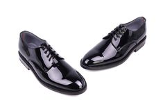 Our classic derby for formal wear, ideal for wearing with a tuxedo. Goodyear welt construction. Patent leather upper and leather lining. Padded leather insole. Leather sole. Leather heel with rubber insert. *Can be manufactured in other colors. Please contact us for a custom quote. **The details and color in this piece may slightly vary to the ones shown, they are a result of the nature of the manufacturing process. Black Goodyear Welted Oxfords For Formal Wear, Black Formal Oxfords With Goodyear Welt, Fitted Black Derby Shoes For Formal Occasions, Goodyear Welted Patent Leather Oxfords For Formal Occasions, Classic Plain Toe Oxfords For Party, Formal Plain Toe Oxfords With Rubber Heel Cap, Black Goodyear Welted Derby Shoes For Formal Occasions, Formal Patent Leather Dress Shoes With Rubber Heel Cap, Black Plain Toe Oxfords For Formal Occasions