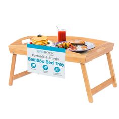 a bamboo bed tray with food on it and a sign that says, breakfast portable & study