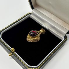 This beautiful pendant dates back to the Georgian era, circa 1820s. Crafted from 18ct gold, it features a stunning garnet heart as the main stone. The pendant is perfect for women who love vintage and antique jewelry. It would make a wonderful addition to any collection, and is sure to be a conversation starter. Condition notes: There is a small mark on the right side of the heart where part has chipped off from normal wear and tear through the years. Original piece from the 1820s. Antique Yellow Gold Heart Pendant Jewelry, Antique Heart Pendant In Yellow Gold, Victorian Antique Gold Heart Pendant Necklace, Hallmarked Heart-shaped Victorian Jewelry, Antique Ruby Necklace For Formal Occasions, Elegant Antique Gold Heart Pendant Necklaces, Victorian Heart-shaped Hallmarked Jewelry, Victorian Yellow Gold Heart Pendant Necklace, Victorian Ruby Jewelry Collectible