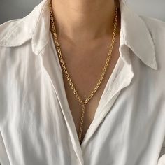 "18K Gold Chain Lariat Necklace | Chunky Chain Y Necklace | Gold Chain Link Layering Necklace | Long Drop Necklace | Statement Necklace  This seamless design lariat is made with gorgeous, solid gold tone chain with etched links that sparkle.  Perfect to layer it for everyday wear.  Super chic and minimal that goes well with all outfits. Lariat necklace with 3\" drop in the center. Check out more styles in our shop: https://jordanskyjewelry.etsy.com Handmade and designed in NY. ------------------------------- M A T E R I A L S  18 Karat gold plated - Non tarnish Stainless Steel Thanks for supporting our small business❤︎ --------------------------------  L E T ' S * C O N N E C T Check out @jordanskyjewelry on Instagram for sales and giveaways!   Enjoy your jewels!! xoxo" Y Necklace Gold, Long Drop Necklace, Necklace Outfit, Necklace Gold Chain, Lion Necklace, 18k Gold Chain, Long Silver Necklace, Y Necklace, Gold Long Necklace