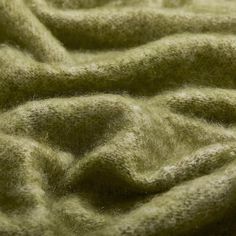 the texture of a green blanket is very soft