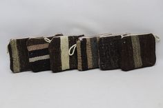 Welcome to TurkishRugOutlet * All Purses are made from one of a kind natural colors vintage Turkish kilims and rugs.  * The price is for the set. I have set of 3, 6 and purses on my shop.  * Item Details: * Handmade Kilim Purses 7 x  9 inches 18 x 22 cm 🧽 Condition: All my purses are cleaned and washed ready for use in your home. 📷 Items color may differ a little according to light it takes. YOU CAN USE AS  Makeup bag, Clutch Bag,  Coin pouch  Bridesmaid gifts Coin purse, Cosmetic Bag,  Gift f Handmade Brown Clutch Coin Purse, Brown Handwoven Rectangular Pouch, Traditional Handmade Brown Pouch, Traditional Brown Rectangular Pouch, Purse Makeup Bag, Pouch Handmade, Handmade Purse, Women Wallet, Purse Vintage