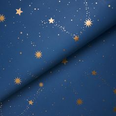 a blue background with gold stars in the sky and white dots on it's surface