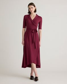 Fitted where you want it, flowy where it feels good. Our Tencel Jersey Midi Wrap Dress is the timeless classic everyone needs in their lineup. Eco-cool and all-day comfy with a rounded collar and modern midi length, it’s as soft as it is sustainable, and it’s part of our growing knit-dress collection. Also offered in sizes 1X-3X.  | Quince | Women's Tencel Jersey Midi Wrap Dress in Wine, Size XL Teacher Wardrobe, Midi Wrap Dress, Plus Size Casual, Quince, Jersey Dress, Timeless Classic, Mother Of The Bride, Midi Length, Dress Collection