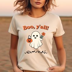 Get into the spooky spirit with our Retro Halloween Shirt! This adorable tee features a cute Halloween ghost design that's perfect for Halloween parties, trick-or-treating, or just celebrating the spooky season. Made with soft, comfortable fabric, it's an ideal Halloween gift or a festive addition to your fall wardrobe. Embrace the season with this must-have Halloween party shirt and show off your Halloween spirit in style! DESCRIPTION 👕 Meticulously made from 100% Airlume combed and ring-spun cotton. 👕 Enhanced with ribbed knit collars for improved shape and durability. 👕 Printed and shipped proudly from the USA. CARE INSTRUCTIONS *Machine wash inside out with similar colors. *Tumble dry on low or hang to dry. *If ironing is necessary, do so inside out and avoid direct contact with the Playful Cartoon Print T-shirt For Fall, Playful Halloween T-shirt With Cartoon Print, Playful Pre-shrunk Tops For Halloween, Playful Crew Neck Tops For Halloween, Fun Halloween T-shirt Pre-shrunk, Fun Halloween Pre-shrunk T-shirt, Fun Pre-shrunk Halloween T-shirt, Novelty T-shirt For Costume Party With Short Sleeves, Playful Fall T-shirt With Cartoon Print