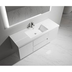 a white bathroom vanity with two sinks and a large mirror over it's face