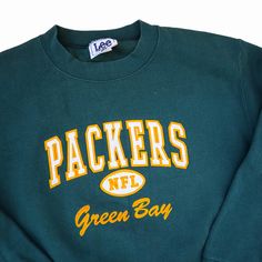 a green bay packers sweatshirt with the words packers on it