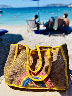 Woven Straw Beach Bag, Large Summer Rainbow Bag, Crochet Personalized Raffia Tote, Market Bag, Embroidered Bag With Sun Clouds Handwoven raffia beach bag with rainbow, clouds and sun is designed by me so it is one of a kind beach bag. It is very large so you can carry many stuff in it. It has inner pocket too. This lovely raffia tote is handwoven from organic straw. It makes a great eco-friendly shopping bag ,vacation bag or beach tote. It can hold a lot of weight, and there is a large pocket in Embroidered Beige Straw Bag For Daily Use, Embroidered Beige Shoulder Bag For Vacation, Brown Embroidered Vacation Bag, Embroidered Brown Vacation Bag, Embroidered Beige Straw Bag For Travel, Summer Embroidered Brown Bag, Embroidered Rectangular Shoulder Bag For Vacation, Rectangular Embroidered Shoulder Bag For Vacation, Embroidered Beach Bag For Travel