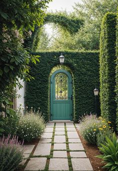 a green door is surrounded by greenery and flowers in front of a stone walkway