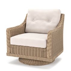 a wicker chair with a white cushion