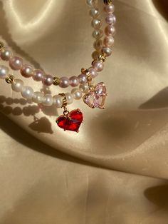 Details: * Gold: Brass/Copper + 18K Gold plated * Platinum: Brass/Copper + Rhodium plated * Genuine Freshwater pearls; Ome Removable zircon heart * No risk of allergy (nickel-free, lead-free, cadmium-free) * The shape and color of the pearls may vary * Size: 42 + 7 cm * Delivered with a cleaning cloth and a ready-to-gift jewelry storage pouch * FREE USAVEL GIFT BOX +50e Note: if you wish it to be shorter/longer, leave us a note when checking out. GIFT At checkout, you can send your selected item Valentine's Day Pearl Necklaces With Heart Beads, Gold Heart Necklace With Pearl Charm For Valentine's Day, Valentine's Day Pearl Jewelry With Pearl Chain, Delicate Pearl Necklace With Heart Charm And Pendant, Dainty Heart Necklace With Pearl Chain For Valentine's Day, Valentine's Day Gold Heart Necklace With Pearl Pendant, Valentine's Day Heart Pendant Necklace With Pearl Charm, Gold Heart Necklace With Pearl Pendant For Valentine's Day, Pearl Heart Beads Jewelry For Mother's Day