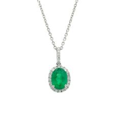 Adorn Yourself With The Breathtaking Beauty Of Our Oval-Cut Emerald Necklace In 18k White Gold. This Enchanting Piece Showcases An Exquisite Oval-Cut Emerald Boasting A Captivating Green Hue That Will Surely Mesmerize. With A Length Of 16 Inches, This Necklace Elegantly Graces Your Neckline, Offering A Delicate And Feminine Touch. The Oval-Cut Emerald Takes Center Stage, Surrounded By A Halo Of Round Diamonds, Adding A Radiant Sparkle To The Already Stunning Gemstone. The Diamonds In This Neckla White Gold Diamond Emerald Necklace With Hallmark, Classic White Gold Emerald Necklace With Diamond Accents, Classic Emerald And Diamond Necklace, Classic Hallmarked Emerald Necklace With Diamonds, Classic Hallmarked Emerald And Diamond Necklace, Classic Hallmarked Diamond Emerald Necklace, Exquisite White Gold Emerald Necklace With Diamond Cut, Platinum Gemstone Necklace In Fine Jewelry Style, Classic Platinum Necklace With Gemstone