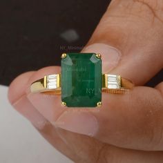 This ring is made with NY Minimalist Solid 14K Yellow Gold Genuine 4.50 Ct. Emerald-Cut Emerald Gemstone Baguette Diamond Engagement Ring Handmade Jewelry * SKU: SR01739 * Made to Order. * Gold Purity: 14K Solid Yellow Gold (stamped) * Custom Gold Color: Yellow, Rose, White Gold * Custom Gold Purity: 9K/14K/18K (Charges Apply) * Diamond 100% Genuine Diamond * Diamond Weight: 0.11 Ct. * Diamond Color: G-H * Diamond Clarity: SI1- SI2 * Diamond Cut: Marquise Cut * Emerald Weight: 4.5 Ct. Product Me Emerald Rings With Baguette Diamonds, Classic 14k Gold Emerald Ring With Baguette Diamonds, Classic Emerald Ring With Baguette Diamonds In 14k Gold, Vintage Emerald Engagement Ring, Emerald Wedding Rings, Emerald Ring Gold, Emerald Cut Engagement, Handmade Engagement Rings, Gold Ring Designs