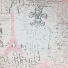 a close up of a piece of fabric with pink and black designs on it, including the eiffel tower