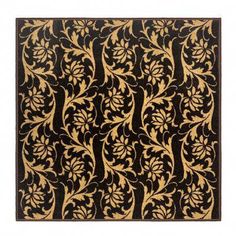 a black and gold rug with an intricate design on the front, side and back