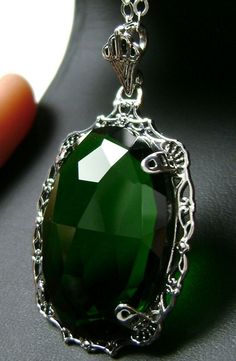 "Simulated Green Emerald Pendant Bubble Design#P10 Custom Made Inspired by Victorian era designs, I now offer this lovely Antique reproduction in sterling silver. The 22ct faceted simulated green emerald gemstone is 24mm long (15/16th\") and 18mm in width (3/4th\"). The entire pendant is 1.5\" long and 7/8\" wide. The chain (if chosen) is between 18-20 inches in length and is marked 925 as well. Notice the beautiful craftsmanship of the Victorian filigree setting. This pendant necklace is a true Victorian Filigree, Filigree Pendant Necklace, Replica Jewelry, Filigree Jewelry, Filigree Pendant, Emerald Pendant, Sterling Silver Filigree, Emerald Gemstone, Green Gemstones