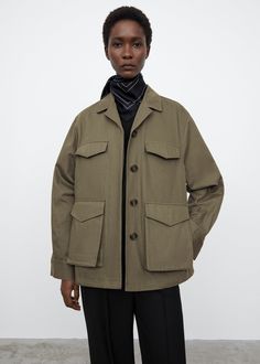 Army-inspired jacket cut from a Japanese cotton fabric. It’s shaped to an oversized silhouette with a concealed button fastening, a nipped-in waist at the back, buttoned cuffs, and utility pockets with built-in slanting side pockets. Dress up with trousers and a silk scarf this spring.