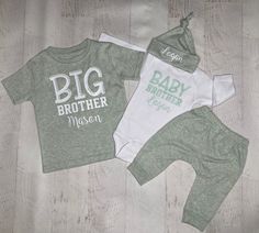 "Big brother and little brother shirts, with optional personalized names! Shown in an adorable super soft sage green and white set. 💜These make a perfect personalized gift set for a new little brother coming home, new big brother announcement, gender reveal, newborn photos and just to wear everyday!   👕 SHIRT/BODYSUIT INFO: Comes in sage green & white combo, unless color changes are left in the notes with your order. For Changes:  Leave shirt or font colors (see photo font chart) in the personalization notes with your order.  These can also be done with no names or changed to sister! Both shirts can be done in the same color.  EXAMPLE: Big brother Noah Little brother Liam gray/white combo SET COLORS: This set (all items) can also be done in these heather colors: Gray Denim navy Oatmeal ( Personalized Green Cotton Tops, Personalized Green Short Sleeve Tops, Personalized Green Cotton T-shirt, Matching Sibling Shirts Coming Home, Big Brother Onesie, Big Brother Cricut Shirt, Big Brother Shirts For Hospital, Brother Announcement, Big Brother Tshirts Boys