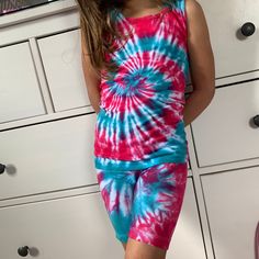 Tie Dye Sets are perfect for any time of year, especially summer! This set includes a tank or short sleeve t-shirt and a pair of biker shorts. These are so cute and every little girl needs a set in her life. Tie-Dye makes everyone happy :) Why not put smiles on all the little girls in your life! Made to Order - There may be slight variations in design. Dyes used will ensure your clothing stays bright & colorful for years to come. T-Shirts and Tanks are 100% cotton. Unisex Sizing. Shorts are Sleeveless Summer Short Set, Sleeveless Summer Short Set For Beach, Sleeveless Summer Beach Short Set, Multicolor Casual Tank Top For Loungewear, Casual Multicolor Tank Top For Loungewear, Casual Multicolor Short Set For Summer, Casual Sleeveless Short Set For Spring, Multicolor Tank Top For Summer Loungewear, Sleeveless Short Set For Summer Loungewear