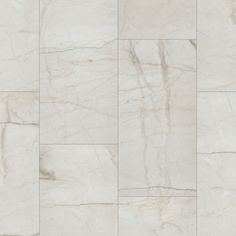 a white marble tile wall with different patterns