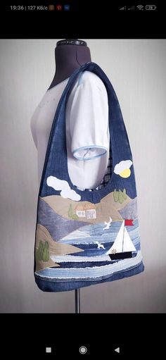 a blue bag on a mannequin's head with a sailboat in the background