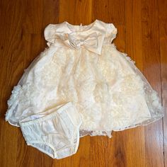 Ivory Colored Baby Girl Dress With Diaper Cover Cream Ruffled Baptism Dress For Dress-up, Cream Ruffled Dress For First Birthday, Cute Cream Dress For First Birthday, Fitted Cream Dress For First Birthday, Elegant Cream Dress For First Birthday, Cute Cream Baptism Dress With Ruffles, Cream Ruffle Dress For First Birthday, Purple Tutu Dress, Black Holiday Dress