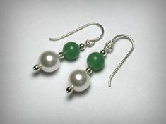 Simple & elegant pair of earrings, featuring green, genuine aventurine stone beads, and Swarovski faux pearls, in solid sterling silver. The pearls measure, 8mm, the aventurine beads ar 6mm. Sterling silver french wire drops. Ships in 2 to 3 business days. Elegant Aventurine Dangle Earrings, Elegant Green Jade Beaded Earrings, Elegant Green Hypoallergenic Beaded Earrings, Elegant Jade Beaded Earrings With Round Beads, Elegant Jade Beaded Round Earrings, Jade Pearl Drop Earrings As Gift, Drop Earrings Pearl, Diamond Nose Stud, Aventurine Stone